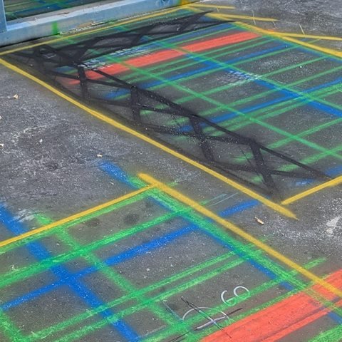GPR scan grid marked in green, blue and orange on a concrete slab