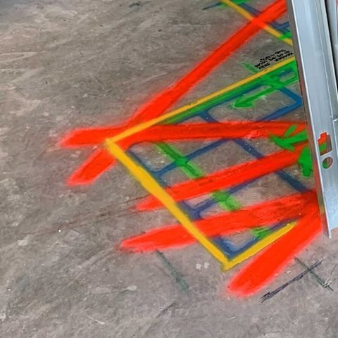 Red lines sprayed across a yellow-bordered GPR scan grid