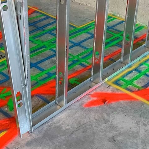 GPR scan grid marked on the floor between steel wall studs